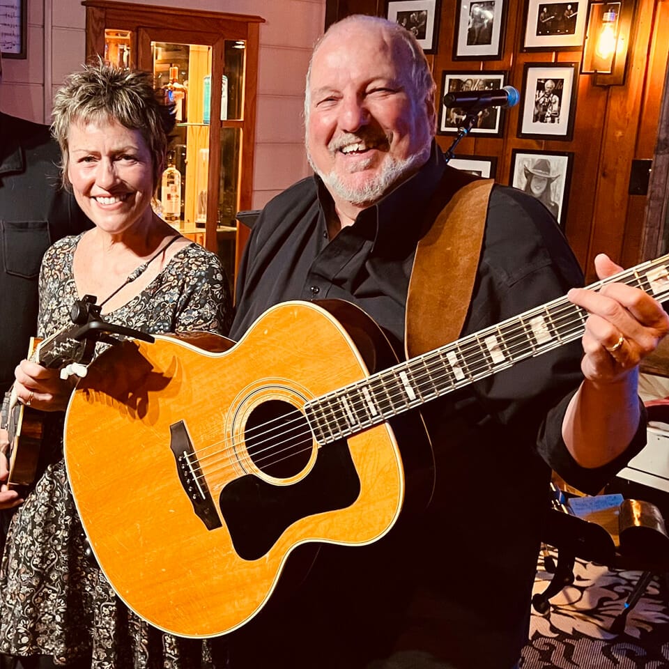 Max & Denise Collins photo with a guitar